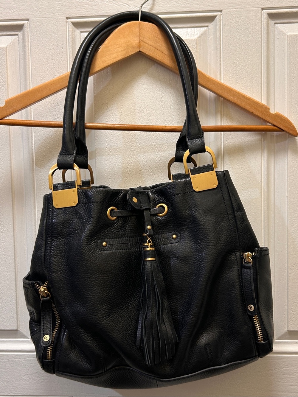 Black Shoulder Tote with Tassel and Gold Hardware